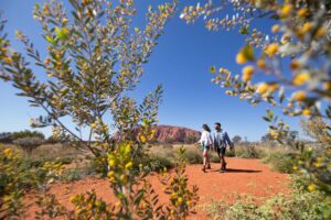 australia nt Uluru walk ayers rock 1089671 41TA Mandatory Credit - Romantic Vacation Packages from Canada for Valentine’s Day Couple walking at Uluru, Australia