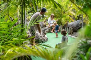 Family playing mini golf, Coral Coast, Fiji