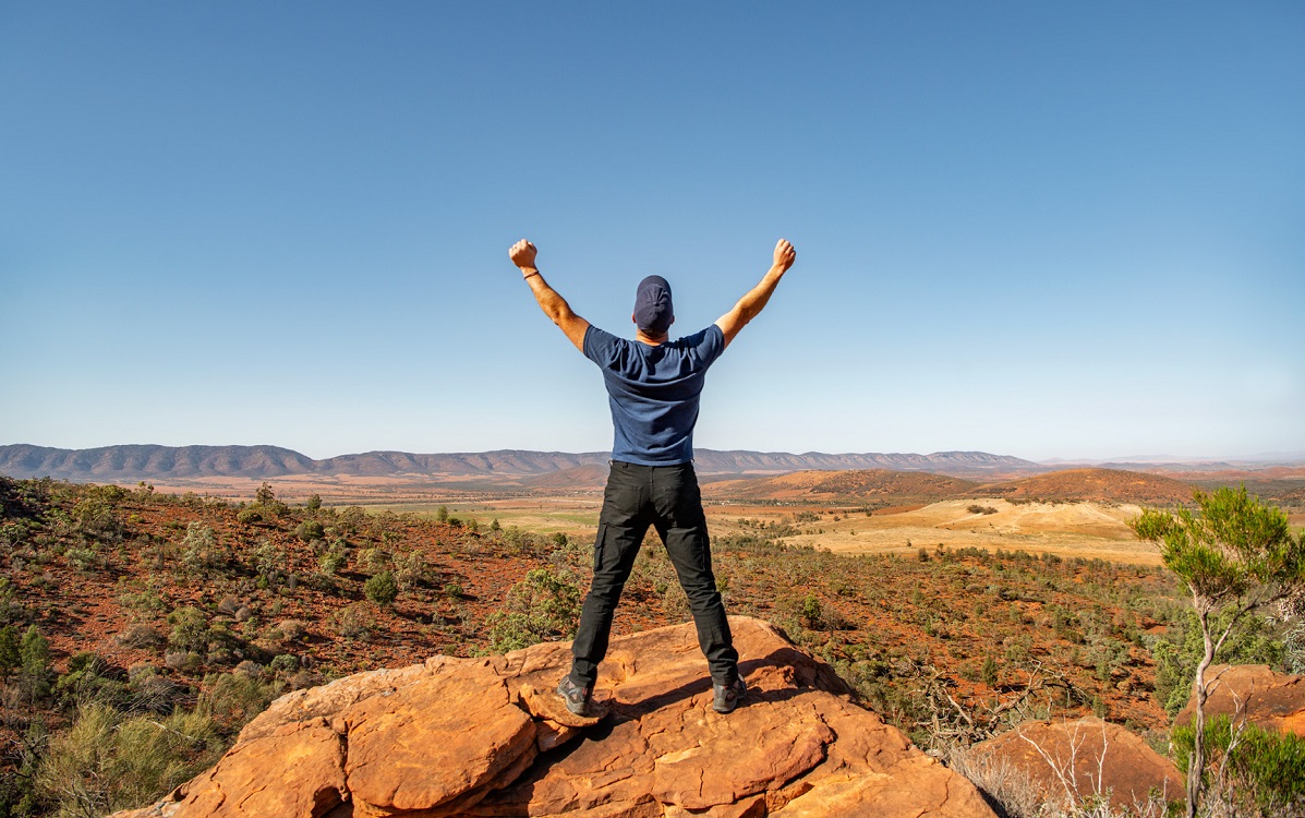 Man standing looking across the Flinders Ranges scenery
