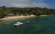 Aerial view if the beach, water and resort at Tides Reach