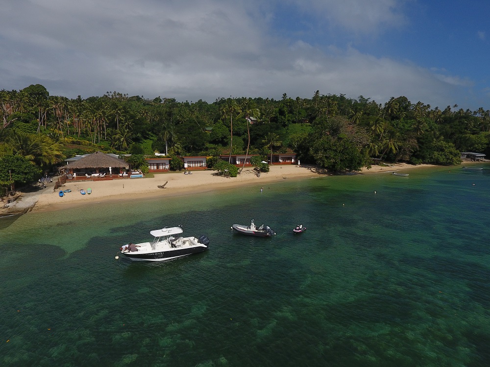 Aerial view if the beach, water and resort at Tides Reach