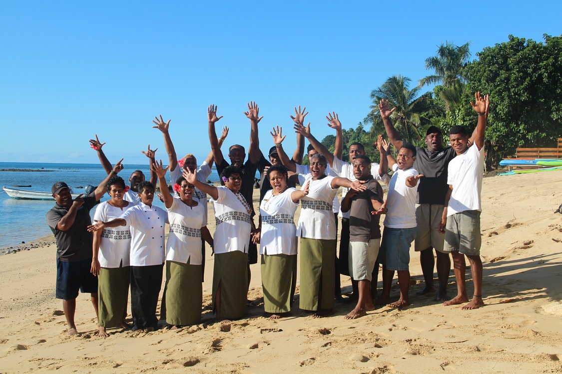 Friendly resort staff on the beach at Tides Reach